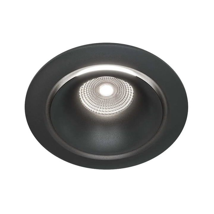 Spot yin led intégrée noir mat avec réflecteur argent texturé et ampoule centrale blanc chaud éclairée