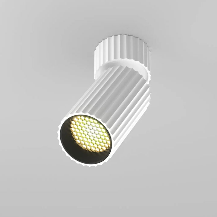 Spot orientable calipso cylindre cannelé blanc avec leds hexagonales émettant une lumière chaude intégrée encastrée