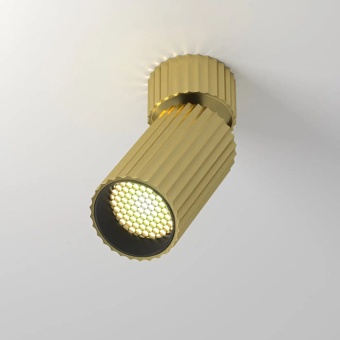 Spot orientable calipso cylindre cannelé couleur or doré avec leds blanches disposées en réseau hexagonal