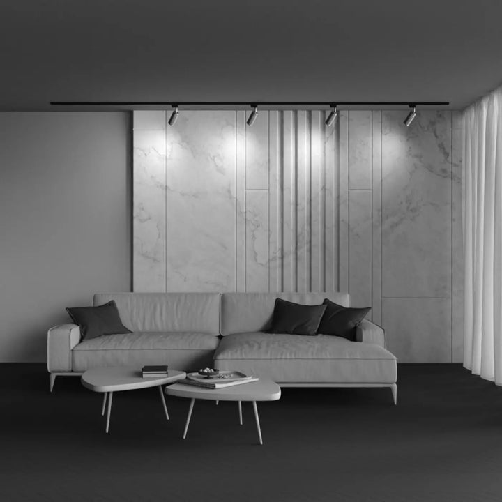 Canapé sectionnel moderne gris focus design avec tête texturée et coussins daccent sombres spot orientable
