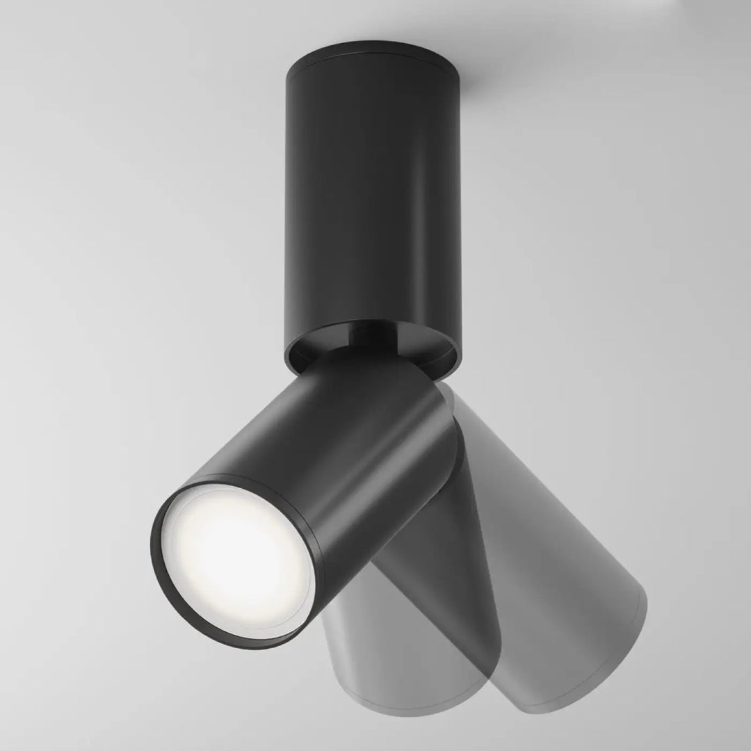 Spot orientable noir avec tête cylindrique et tige fine en métal mat pour éclairage encastré intérieur