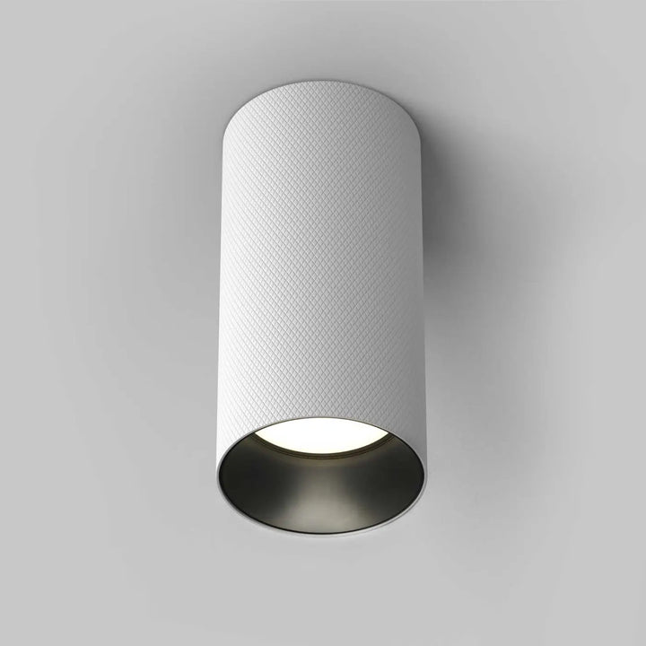 Spot artisan est un spot saillie en aluminium texturé blanc avec culot gu10 pour faux plafond design moderne