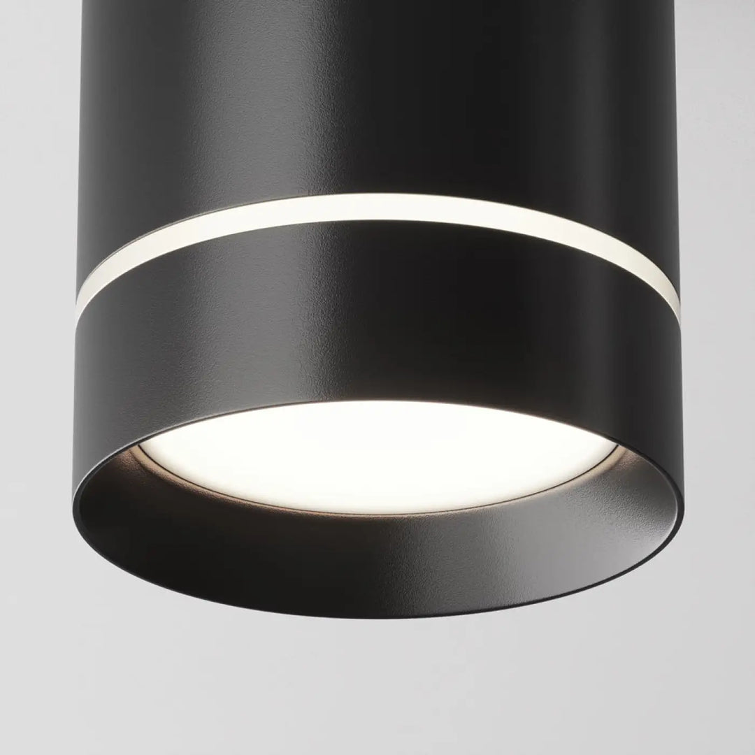 Spot orlo cylindre compact en acier noir avec finition mate et anneau lumineux circulaire au plafond