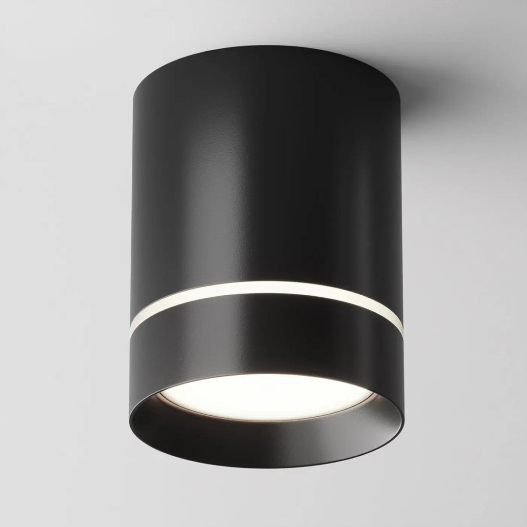 Spot orlo cylindre compact en acier noir avec finition mate et anneau lumineux blanc pour éclairage plafond moderne