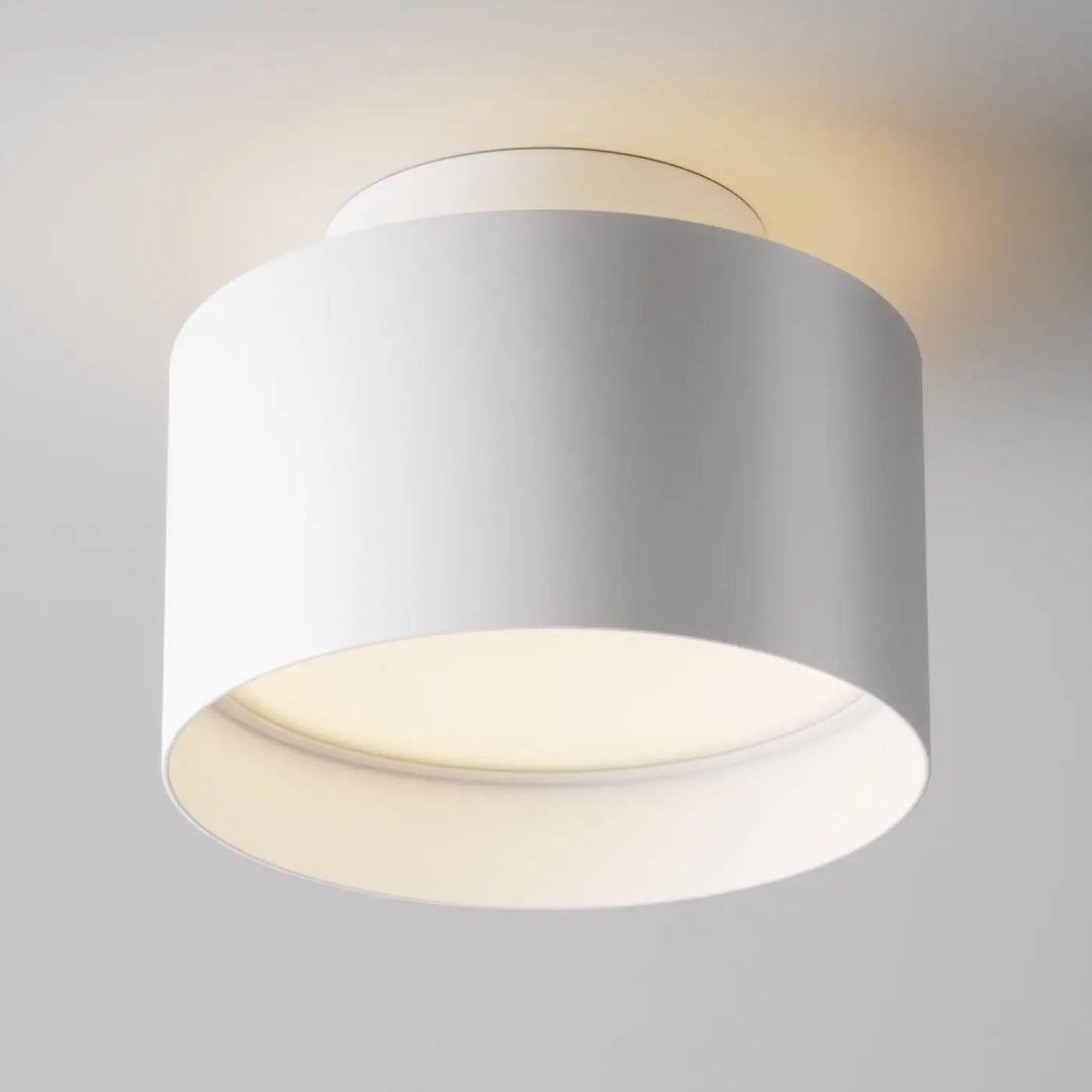 Spot large cylindre plafond blanc avec lumière led saillie planet en acier noir et diffusion douce moderne