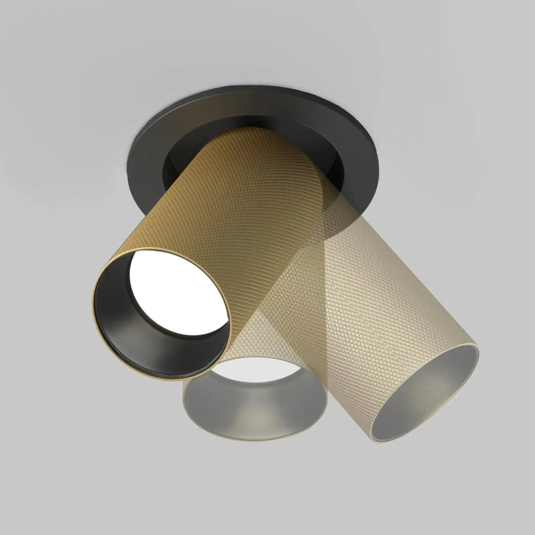 Spot semi-encastré artisan avec deux abat-jours cylindriques texturés en aluminium doré et base circulaire noire mate