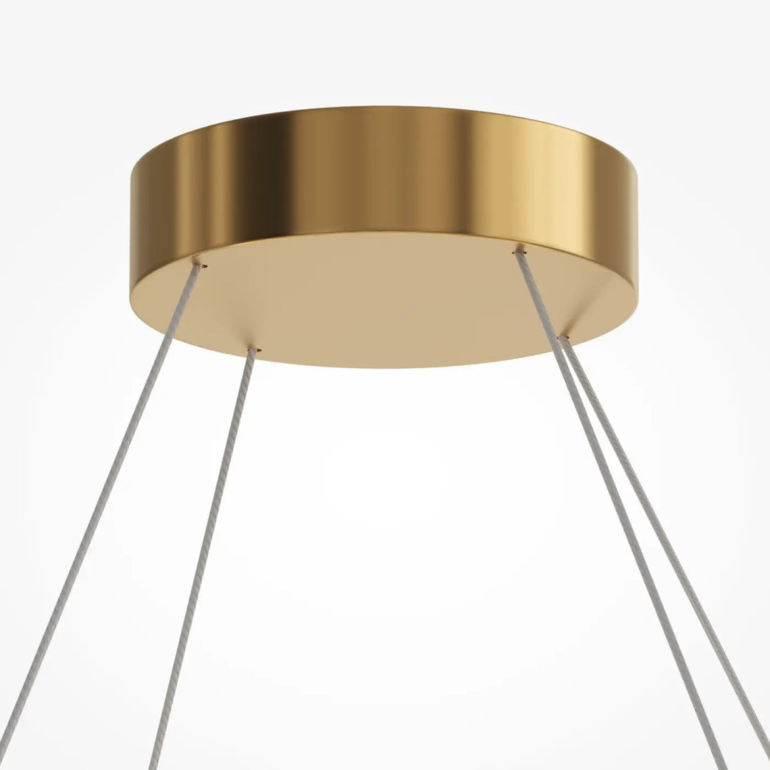 Suspension amulet en métal doré avec verre strié et câbles gris fins pour un éclairage moderne au plafond