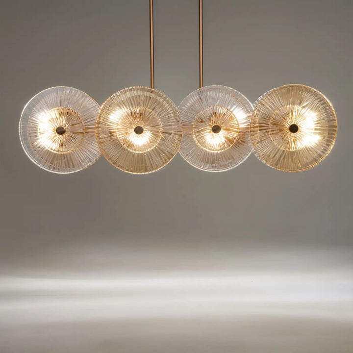 Suspension aster moderne à quatre lumières avec disques en verre ambré et monture dorée en métal