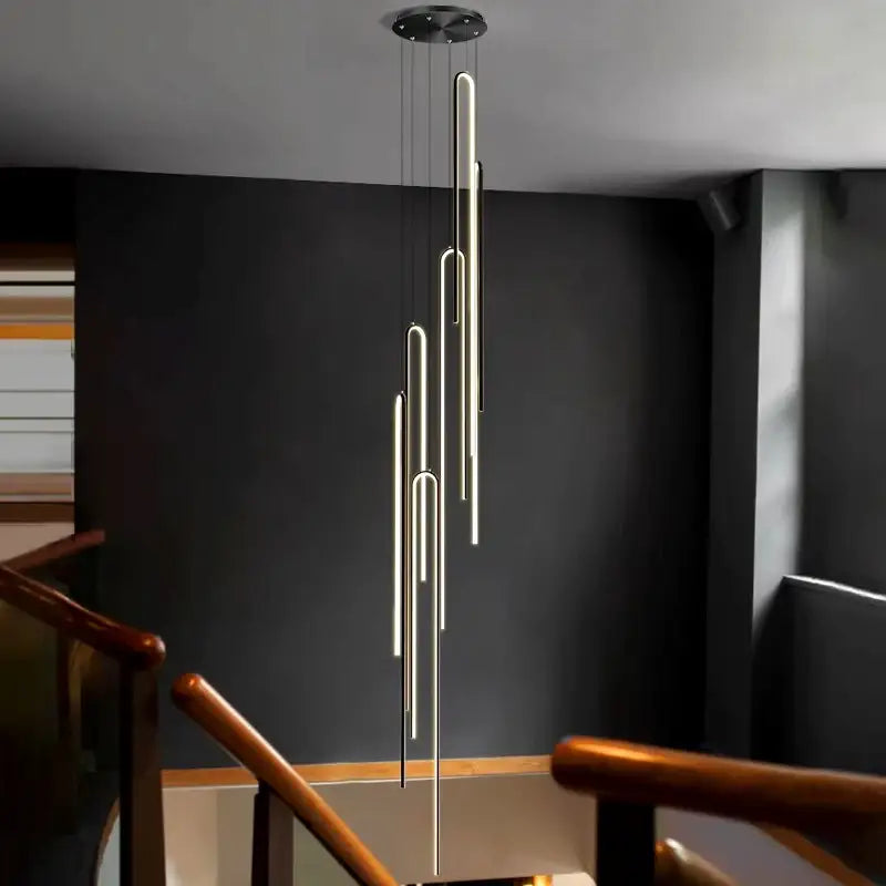 Suspension Cascade Cylindres Dorés Haut Plafond Moderne