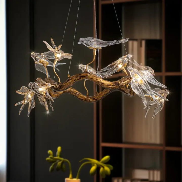 Suspension design branche dorée avec oiseaux en verre