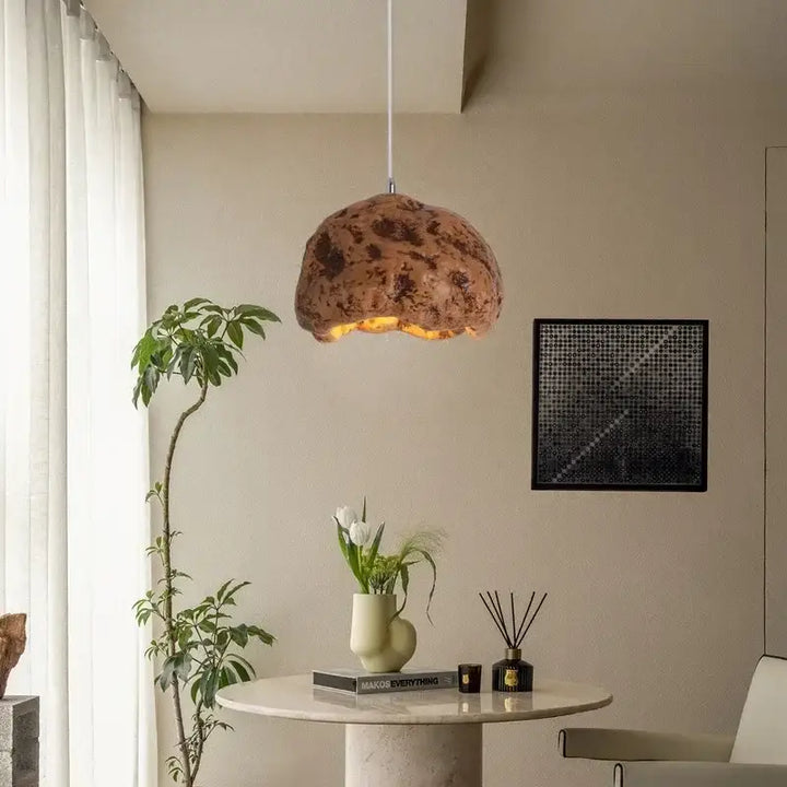 Suspension design effet roche brute lumière chaleureuse

