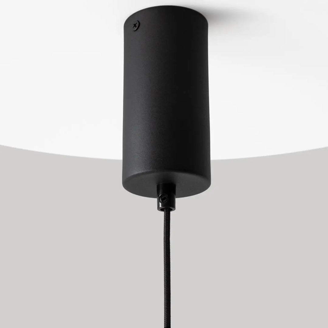 Suspension el led en aluminium noir avec lumière douce et finition mate en forme de cylindre suspendu par un cordon