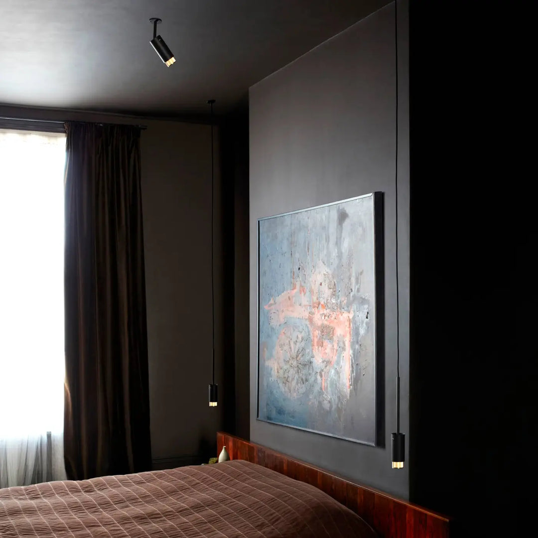 Luminaire Exhaust graphite et laiton dans un intérieur #couleur_dor
