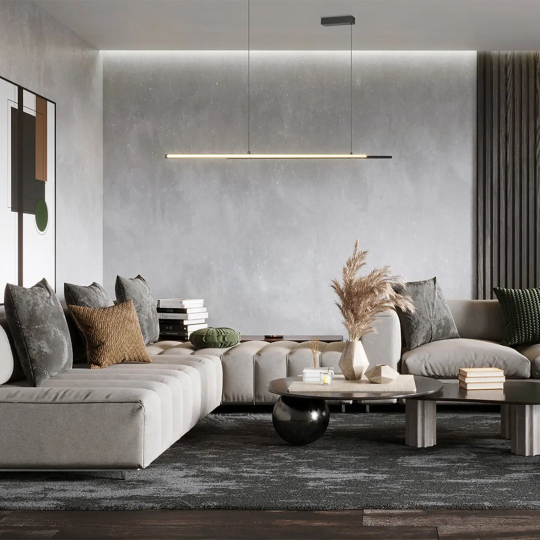 Table basse moderne minimaliste avec plateau rond en verre et pieds effet béton dans suspension halo blanc chaud diffusion latérale