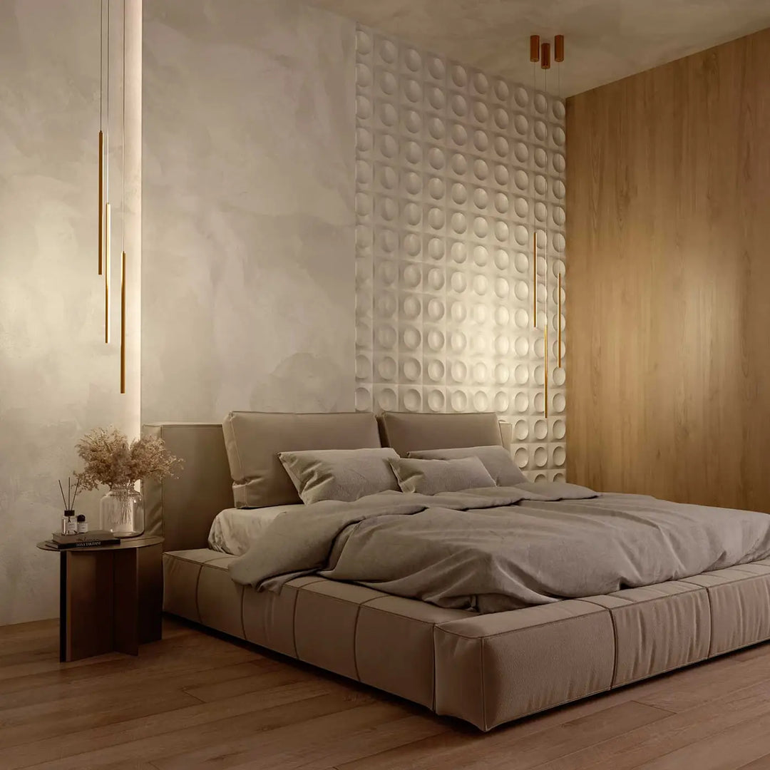 Suspension halo tube vertical en acier doré au-dessus d un lit plateforme moderne tapis taupe avec capitonnage et coussins assortis