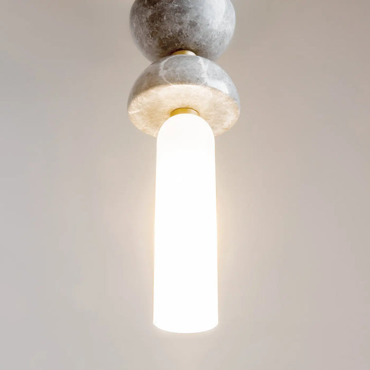 Suspension kyoto cylindre avec deux sphères en marbre gris poli et lumière douce diffusée par un cylindre en verre dépoli