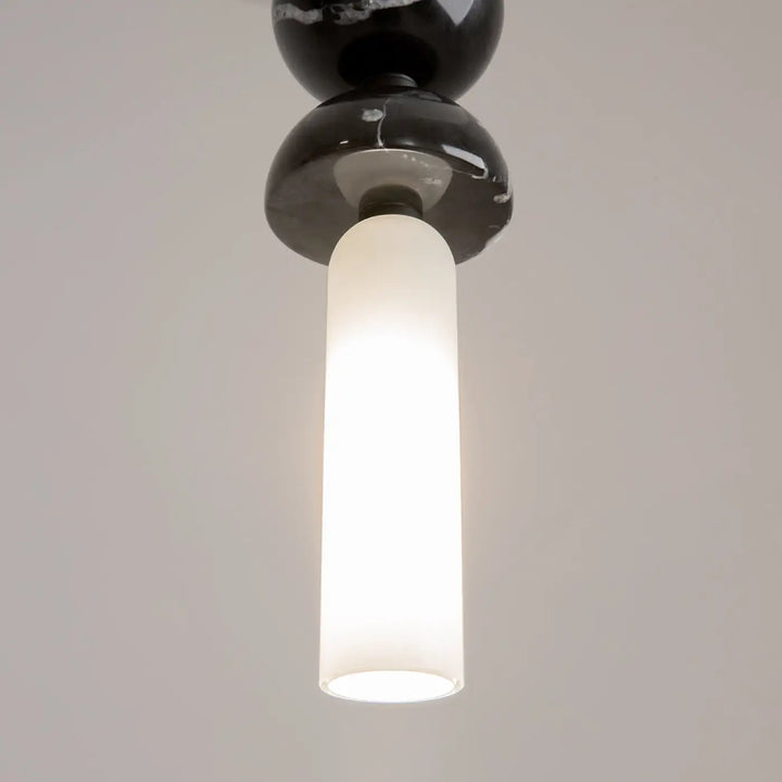 Suspension kyoto cylindre en marbre noir avec cylindre en verre givré pour une lumière douce élégante