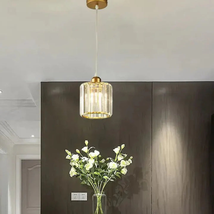 Suspension luminaire cristal doré et noir cylindrique élégant

