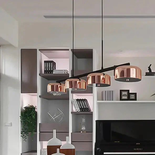 Suspension luminaire linéaire moderne à quatre abat-jours cuivrés

