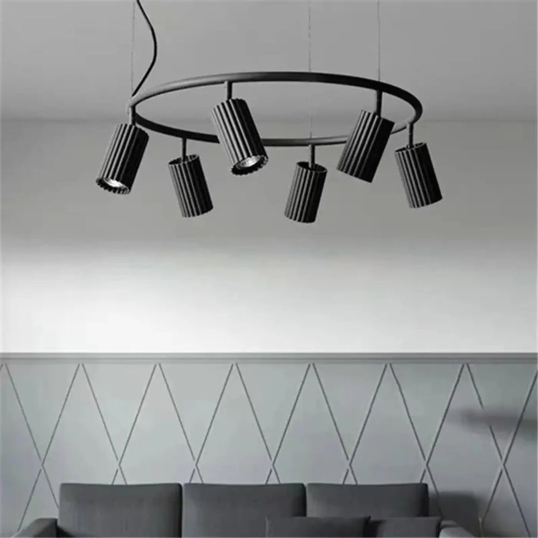 Suspension luminaire zynth noir avec cinq cylindres texturés pour un éclairage minimaliste et design