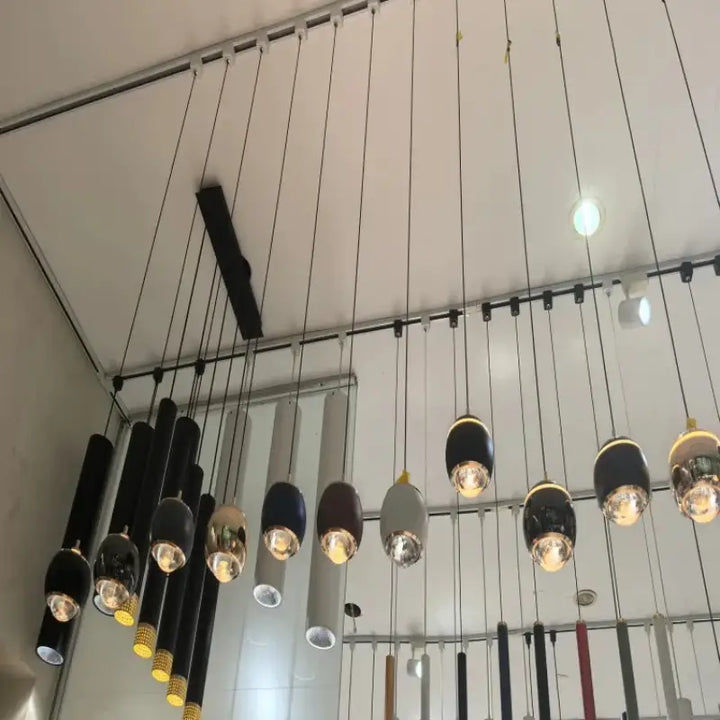 Suspension luminaire moderne boule métal noir et doré chic