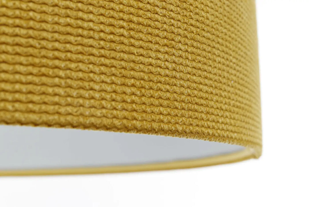 Suspension luminaire en tissu jaune moutarde avec motif tricoté texturé et doublure intérieure blanche lisse pour décoration intérieure