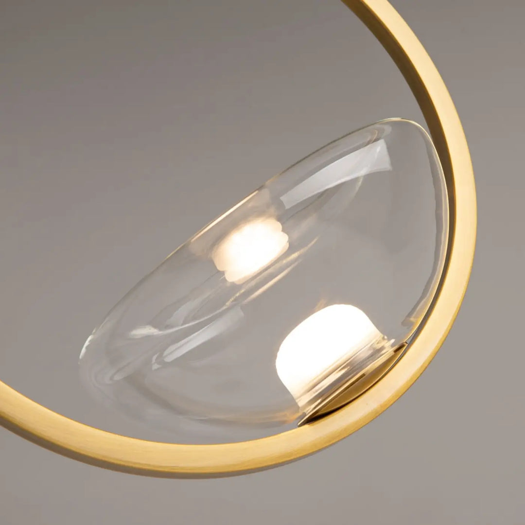 Suspension lunare disque doré avec cadre circulaire moderne et abat-jour en verre clair en forme de goutte led disque doré