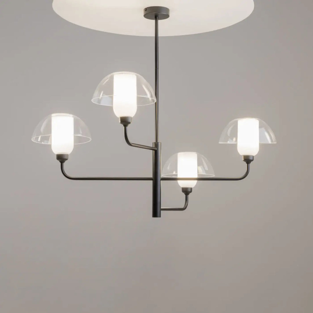 Suspension memory en acier noir avec quatre abat-jours en verre blanc givré et couvercles dômes transparents