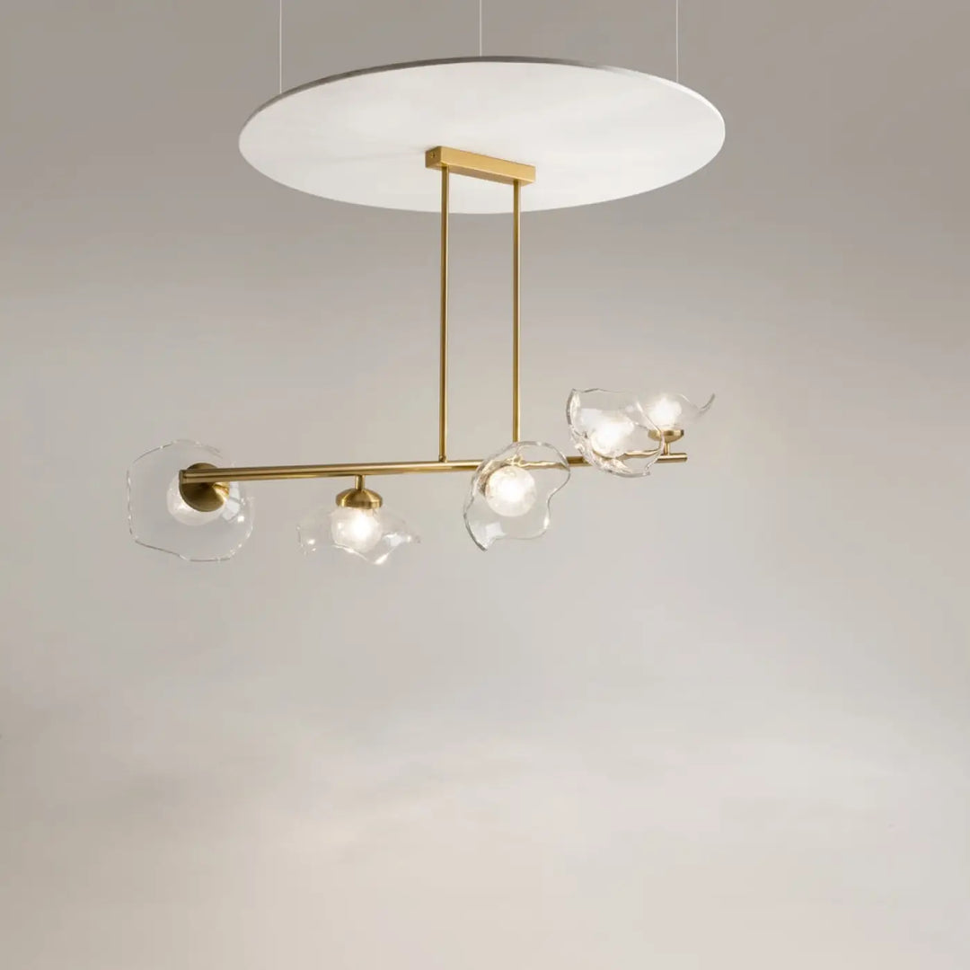 Suspension miracle en verre clair et laiton doré avec une barre dorée et cinq diffuseurs fixé à une plaque circulaire blanche