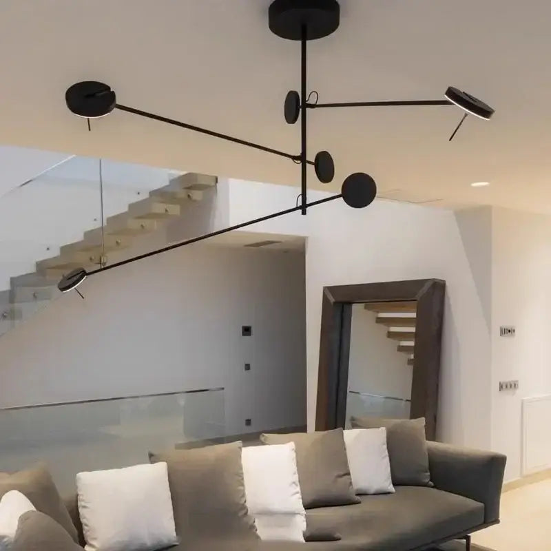 Suspension moderne noire à branches et disques lumineux

