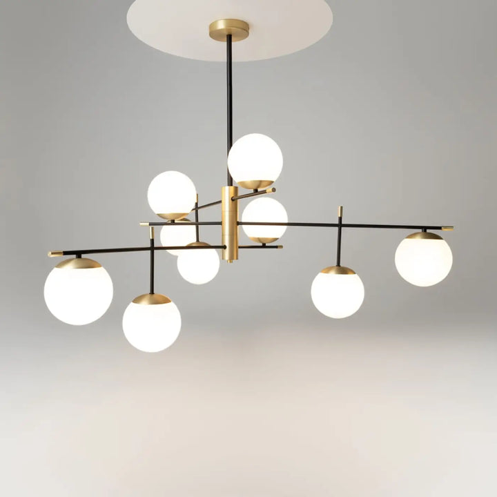 Suspension luminaire nostalgia xxl en acier noir avec neuf globes en verre dépoli et accents dorés modernes