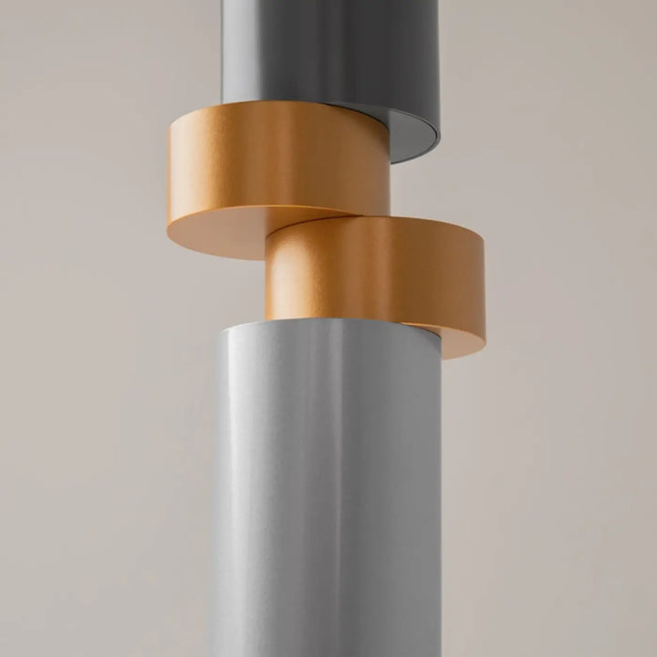 Suspension palette avec tube asymétrique en verre gris et disque cuivré finition mate moderne