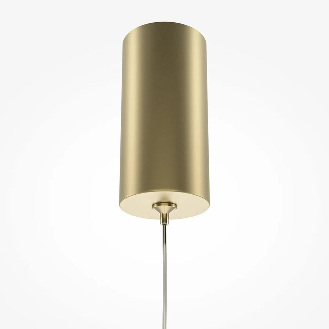 Suspension pro tube lumineux en laiton cylindrique au design minimaliste avec finition métallique polie au-dessus d’un espace