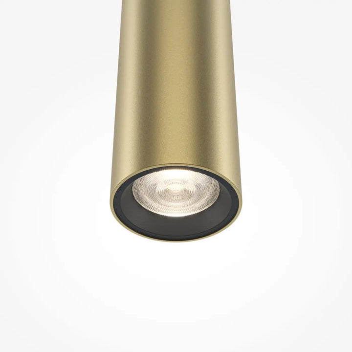 Suspension pro tube lumineux en métal doré avec finition cylindrique noir au-dessus d’un led intégré