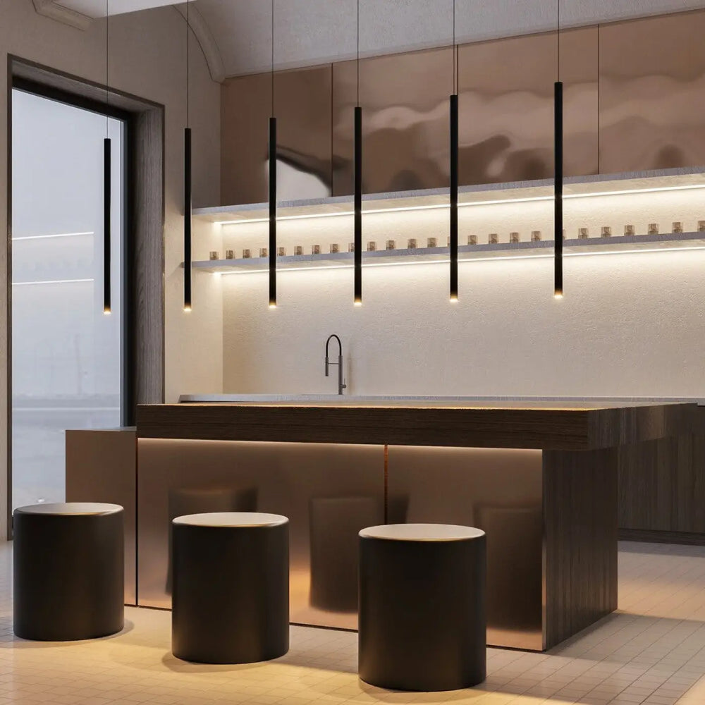 Suspension pro tube lumineux au-dessus d’un espace moderne avec lampe cylindrique noire minimaliste et élégante