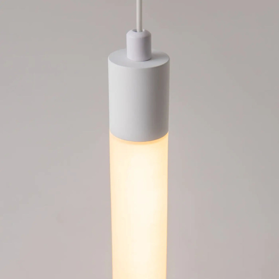 Suspension luminaire ray tube lumineux led intégrée blanche cylindrique avec un éclairage chaud diffus minimaliste