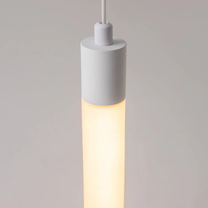 Suspension luminaire ray tube lumineux led intégrée blanche cylindrique avec un éclairage chaud diffus minimaliste