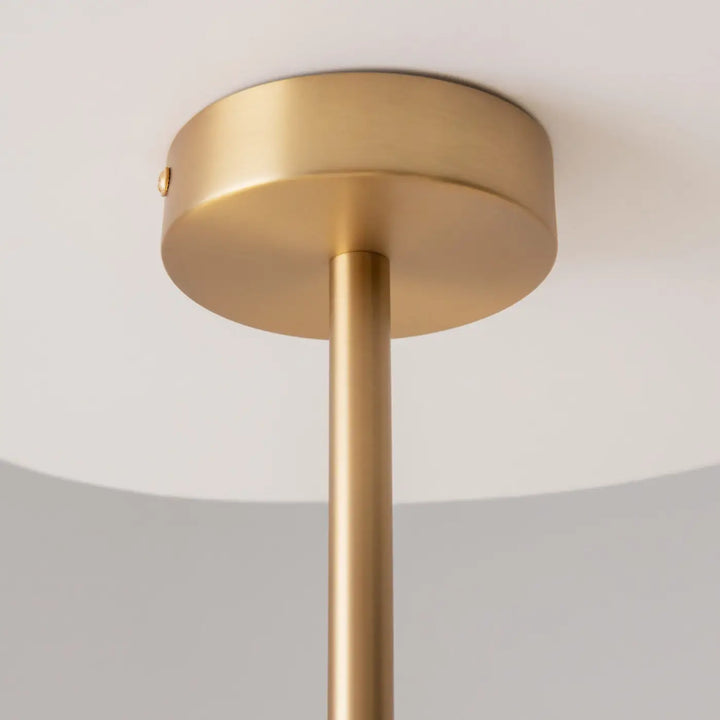 Suspension rendez avec branches dorées en finition laiton et tige verticale fine pour lumière plafond en verre transparent